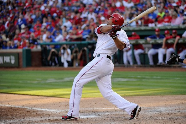 Nelson Cruz blasts one of his 2011 postseason home runs wearing the New Balance 1103 PE cleats. Nelson Cruz blasts one of his 2011 postseason home runs wearing the New Balance 1103 PE cleats.